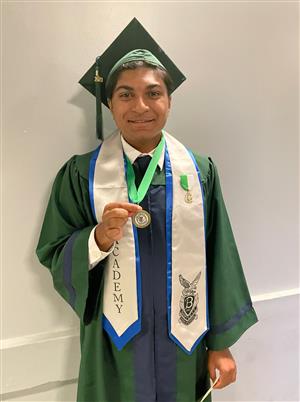Student showing off his Seal of Biliteracy 